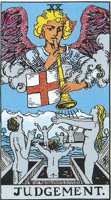 Tarot Card - Judgement 
The top half of the card is dominated by an angelic winged figure blowing a horn from which hangs a white flag separated into 4 quadrants by a large red cross.  Under him are naked men, women, and children standing in coffins in the shadows and all with arms raised
